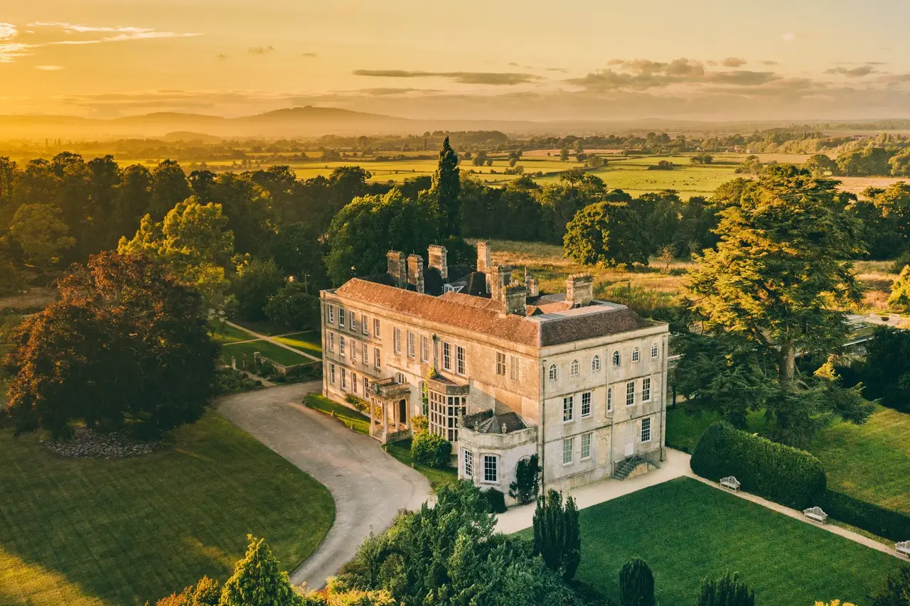 Elmore Court, Gloucestershire — aerial view at golden hour